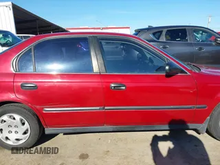 1997 Honda Civic LX with VIN 1HGEJ6678VL030963, listed as a IAAI auction lot 41880866 with 142,472 mi miles. Bid and sale history available at carsss.com. Image 13.