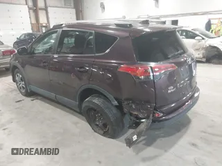 2018 Toyota RAV4 LE with VIN 2T3BFREV0JW759714, listed as a IAAI auction lot 41823084 with 119,909 mi miles and . Bid and sale history available at DreamBid. Image 3.