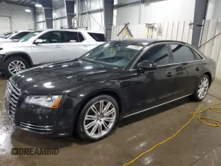 2011 Audi A8 z VIN WAURVAFD8BN005569, wystawiony jako Copart lot #52101065 z przebiegiem 104 893 mil mil oraz Szkody całkowita. Historia ofert i sprzedaży dostępna na DreamBid. Obrazek 1.