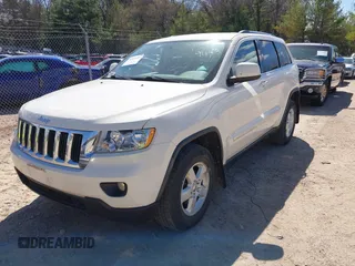 2011 Jeep Grand Cherokee Laredo with VIN 1J4RR4GG9BC556083, listed as a IAAI auction lot 42139453 with 145,623 mi miles and . Bid and sale history available at DreamBid. Image 2.