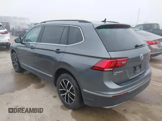 2021 Volkswagen Tiguan SE with VIN 3VV2B7AX8MM143189, listed as a IAAI auction lot 41646843 with 56,672 mi miles and . Bid and sale history available at DreamBid. Image 3.