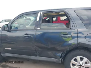 2008 Mazda Tribute ES with VIN 4F2CZ06188KM01024, listed as a IAAI auction lot 41890148 with 122,367 mi miles. Bid and sale history available at carsss.com. Image 14.