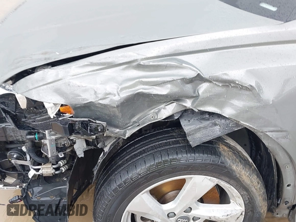 2020 Audi Q3 Premium z VIN WA1AECF30L1052472, wystawiony jako IAAI lot #41886809 z przebiegiem 101 600 mil mil oraz . Historia ofert i sprzedaży dostępna na DreamBid. Obrazek 6.