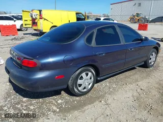 1998 Ford Taurus LX with VIN 1FAFP52U0WA226924, listed as a IAAI auction lot 41702083 with 55,998 mi miles. Bid and sale history available at carsss.com. Image 4.