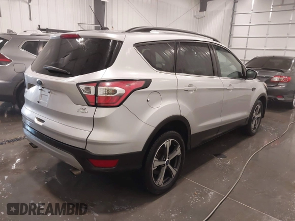 2017 Ford Escape SE with VIN 1FMCU0GD7HUD18367, listed as a IAAI auction lot 41695099 with 54,185 mi miles. Bid and sale history available at carsss.com. Image 4.