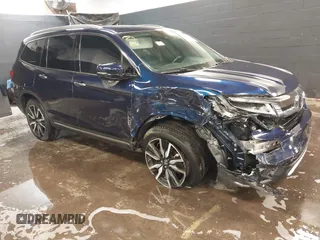 2022 Honda Pilot Touring 7-Passenger with VIN 5FNYF6H65NB052164, listed as a IAAI auction lot 41641601 with 51,700 mi miles. Bid and sale history available at carsss.com. Image 1.