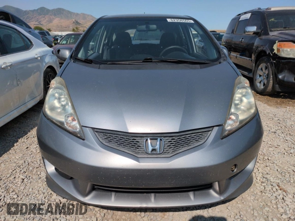 2010 Honda Fit Sport with VIN JHMGE8H41AC002070, listed as a Copart auction lot 62356565 with 148,279 mi miles and Salvage title. Bid and sale history available at DreamBid. Image 5.