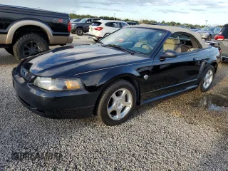 2004 Ford Mustang Deluxe with VIN 1FAFP44414F125267, listed as a Copart auction lot 74595714 with 0 mi miles and Salvage Title. Bid and sale history available at carsss.com. Image 1.
