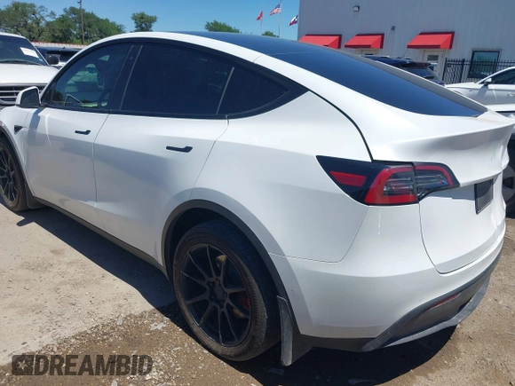 2022 Tesla Model Y Long Range z VIN 7SAYGDEE3NF426481, wystawiony jako IAAI lot #42076729 z przebiegiem 21 648 mil mil oraz . Historia ofert i sprzedaży dostępna na DreamBid. Obrazek 3.