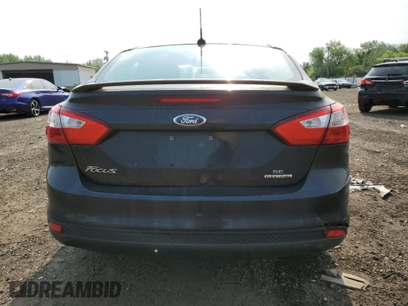 2013 Ford Focus SE with VIN 1FADP3F21DL280156, listed as a Copart auction lot 59814185 with 103,252 mi miles and Salvage title. Bid and sale history available at DreamBid. Image 6.