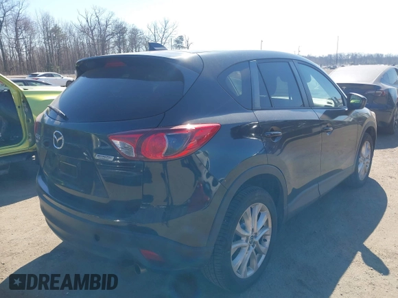 2014 Mazda CX-5 Grand Touring with VIN JM3KE4DY1E0339690, listed as a IAAI auction lot 41668780 with 216,825 mi miles. Bid and sale history available at carsss.com. Image 4.
