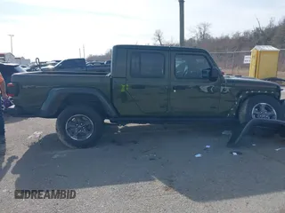 2023 Jeep Gladiator Rubicon with VIN 1C6JJTBGXPL586154, listed as a IAAI auction lot 41370352 with 11,207 mi miles and . Bid and sale history available at DreamBid. Image 13.