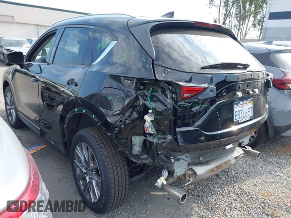 2020 Mazda CX-5 Grand Touring with VIN JM3KFADM3L1819939, listed as a IAAI auction lot 42749920 with 35,407 mi miles and . Bid and sale history available at DreamBid. Image 3.