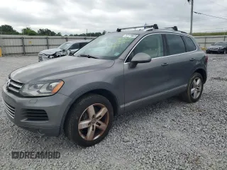 2013 Volkswagen Touareg Exec с VIN WVGEF9BP5DD012710, выставлен на аукционе Copart как лот 57174625 с пробегом 66 484 миль миль и Списание • Salvage title. История ставок и продаж доступна на DreamBid. Изображение 1.