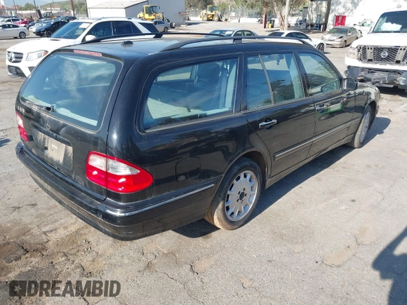 2001 Mercedes-Benz E-Class with VIN WDBJH65J31B381879, listed as a IAAI auction lot 41855504 with 153,667 mi miles. Bid and sale history available at carsss.com. Image 4.