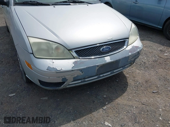 2007 Ford Focus S z VIN 1FAFP34N67W338545, wystawiony jako IAAI lot #42111366 z przebiegiem 370 000 mil mil oraz . Historia ofert i sprzedaży dostępna na DreamBid. Obrazek 6.