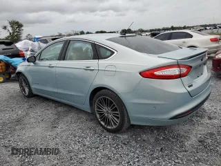 2013 Ford Fusion SE Hybrid z VIN 3FA6P0LU6DR174719, wystawiony jako Copart lot #62877715 z przebiegiem 52 884 mil mil oraz Szkoda całkowita • Salvage title. Historia ofert i sprzedaży dostępna na DreamBid. Obrazek 2.
