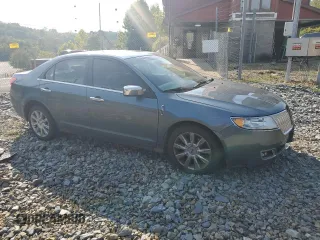 2012 Lincoln MKZ z VIN 3LNHL2GCXCR827302, wystawiony jako Copart lot #70519604 z przebiegiem 150 416 mil mil oraz Szkoda całkowita • Salvage title. Historia ofert i sprzedaży dostępna na DreamBid. Obrazek 4.