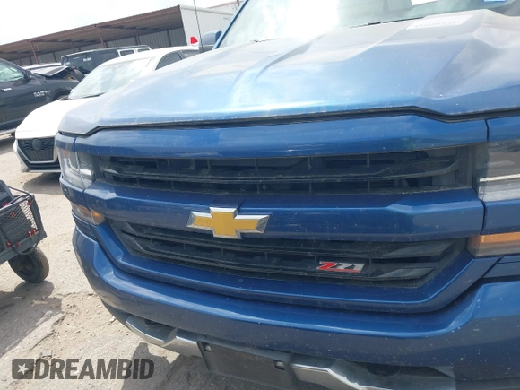 2017 Chevrolet Silverado 1500 LT with VIN 3GCUKREC8HG462719, listed as a IAAI auction lot 41940176 with 380,676 mi miles and . Bid and sale history available at DreamBid. Image 12.