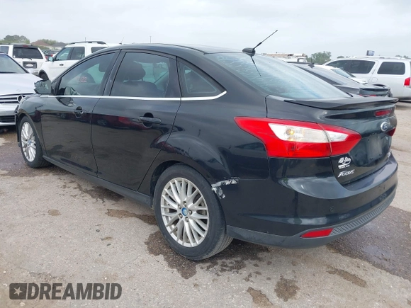 2013 Ford Focus Titanium with VIN 1FADP3J23DL152122, listed as a IAAI auction lot 41935180 with 175,065 mi miles and . Bid and sale history available at carsss.com. Image 3.