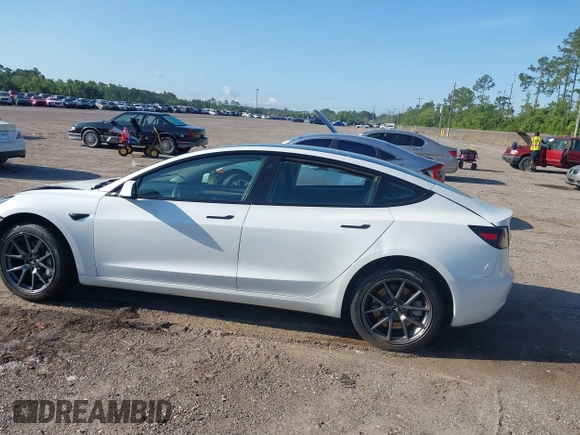 2023 Tesla Model 3 with VIN 5YJ3E1EA9PF557880, listed as a IAAI auction lot 42481413 with 40,582 mi miles and . Bid and sale history available at DreamBid. Image 13.