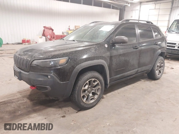 2020 Jeep Cherokee Trailhawk z VIN 1C4PJMBX4LD507364, wystawiony jako IAAI lot #41202333 z przebiegiem 90 000 mil mil oraz . Historia ofert i sprzedaży dostępna na DreamBid. Obrazek 19.