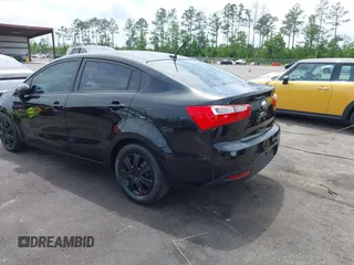 2014 Kia Rio LX with VIN KNADM4A33E6335499, listed as a IAAI auction lot 42123085 with 148,146 mi miles and . Bid and sale history available at DreamBid. Image 3.