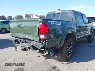 2021 Toyota Tacoma SR z VIN 3TMCZ5AN7MM395940, wystawiony jako IAAI lot #41860127 z przebiegiem 39 338 mil mil oraz . Historia ofert i sprzedaży dostępna na DreamBid. Obrazek 6.