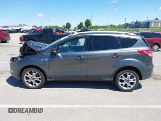2015 Ford Escape Titanium z VIN 1FMCU9J92FUB01007, wystawiony jako IAAI lot #42319246 z przebiegiem 90 782 mil mil oraz . Historia ofert i sprzedaży dostępna na DreamBid. Obrazek 15.
