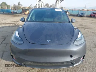 2023 Tesla Model Y Long Range with VIN 7SAYGDEE7PA196038, listed as a IAAI auction lot 41459601 with 16,489 mi miles and . Bid and sale history available at DreamBid. Image 12.
