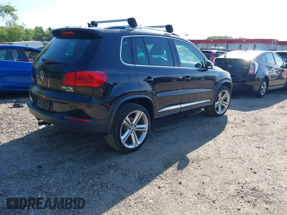 2014 Volkswagen Tiguan S z VIN WVGBV3AX5EW560393, wystawiony jako IAAI lot #42105203 z przebiegiem 102 001 mil mil oraz . Historia ofert i sprzedaży dostępna na DreamBid. Obrazek 4.