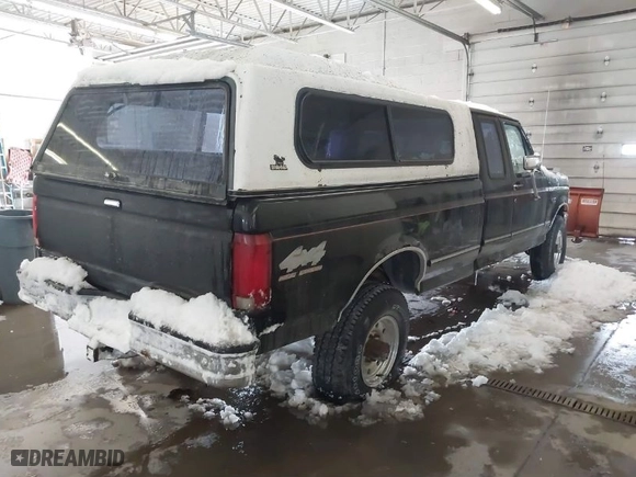 1997 Ford F-250 HD with VIN 1FTHX26G8VEA69320, listed as a IAAI auction lot 41577044 with 120,878 mi miles. Bid and sale history available at carsss.com. Image 4.