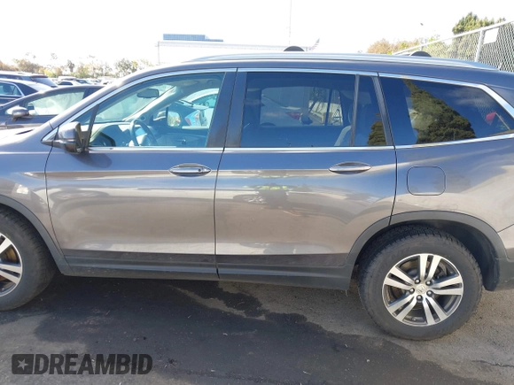 2017 Honda Pilot EX-L with VIN 5FNYF6H57HB021350, listed as a IAAI auction lot 41673635 with 101,980 mi miles and . Bid and sale history available at DreamBid. Image 14.