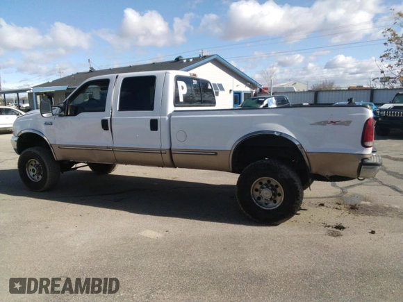 1999 Ford Super Duty F-250 XL with VIN 1FTNW21F0XEA24718, listed as a Copart auction lot 44987595 with 327,455 mi miles and Salvage Title. Bid and sale history available at carsss.com. Image 2.