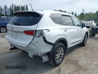 2020 Hyundai Santa Fe SE with VIN 5NMS23AD1LH192085, listed as a IAAI auction lot 42455451 with 50,517 mi miles and . Bid and sale history available at DreamBid. Image 4.