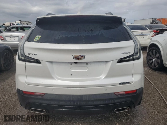 2022 Cadillac XT4 FWD Sport z VIN 1GYFZER44NF118862, wystawiony jako Copart lot #55231775 z przebiegiem 14 983 mil mil oraz Nie do naprawy • Non repairable. Historia ofert i sprzedaży dostępna na DreamBid. Obrazek 6.