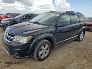 2012 Dodge Journey SXT with VIN 3C4PDCBG9CT208187, listed as a Copart auction lot 61969185 with 156,295 mi miles and Salvage title. Bid and sale history available at DreamBid. Image 1.
