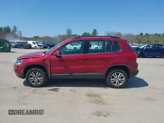 2015 Volkswagen Tiguan SE z VIN WVGBV7AX7FW056002, wystawiony jako IAAI lot #42122641 z przebiegiem 77 037 mil mil oraz . Historia ofert i sprzedaży dostępna na DreamBid. Obrazek 14.
