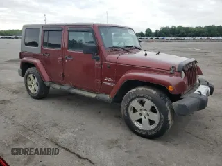 2008 Jeep Wrangler Unlimited Sahara z VIN 1J8GA59108L648333, wystawiony jako Copart lot #57430015 z przebiegiem 506 770 mil mil oraz Czysty tytuł • Clean title. Historia ofert i sprzedaży dostępna na DreamBid. Obrazek 4.