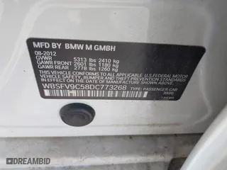 2013 BMW M5 with VIN WBSFV9C58DC773268, listed as a IAAI auction lot 41890830 with 128,399 mi miles. Bid and sale history available at carsss.com. Image 9.