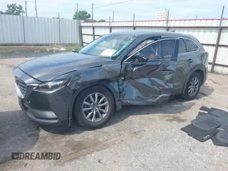 2019 Mazda CX-9 Sport with VIN JM3TCABY0K0327361, listed as a IAAI auction lot 42362232 with 264,699 mi miles and . Bid and sale history available at DreamBid. Image 2.
