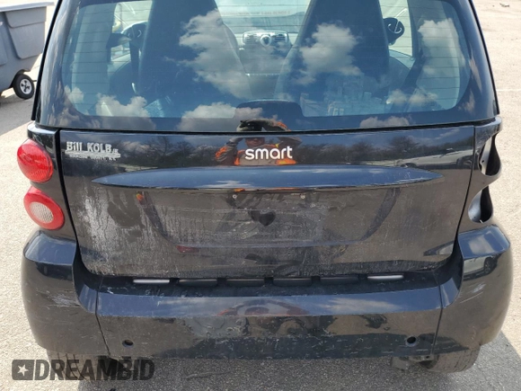 2008 Smart fortwo Pure z VIN WMEEJ31X78K205574, wystawiony jako Copart lot #67711894 z przebiegiem Nie podano mil oraz Tytuł czysty. Historia ofert i sprzedaży dostępna na DreamBid. Obrazek 11.