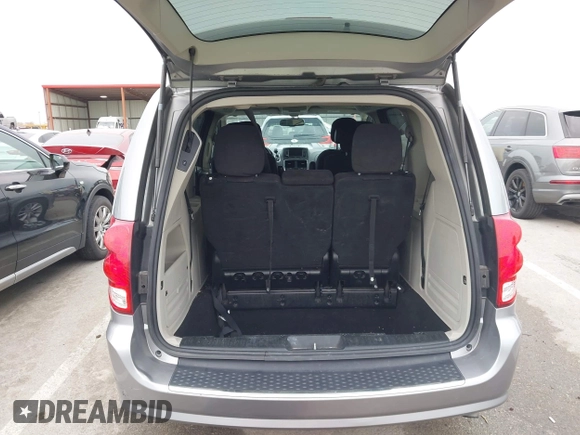 2014 Dodge Grand Caravan SXT with VIN 2C4RDGCG0ER417662, listed as a IAAI auction lot 41933279 with 156,751 mi miles and . Bid and sale history available at DreamBid. Image 18.