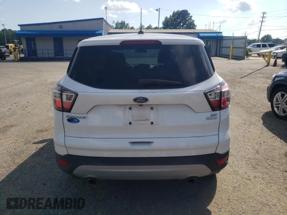 2017 Ford Escape SE z VIN 1FMCU0GD8HUA54074, wystawiony jako Copart lot #58860525 z przebiegiem 149 668 mil mil oraz Szkoda całkowita • Salvage title. Historia ofert i sprzedaży dostępna na DreamBid. Obrazek 6.