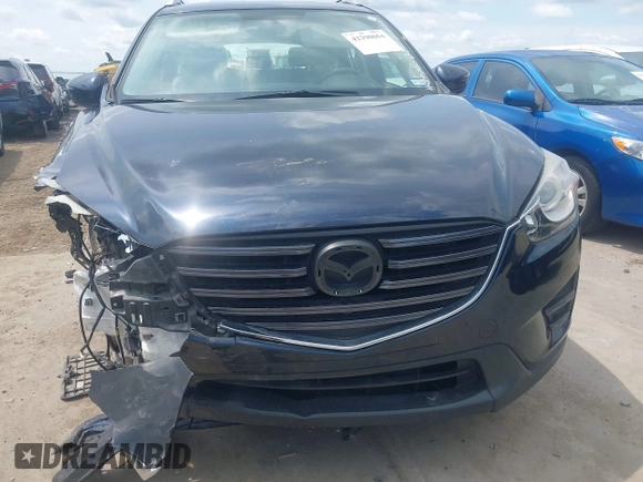 2016 Mazda CX-5 Sport z VIN JM3KE2BY0G0633611, wystawiony jako IAAI lot #42390654 z przebiegiem Nie podano mil oraz . Historia ofert i sprzedaży dostępna na DreamBid. Obrazek 6.