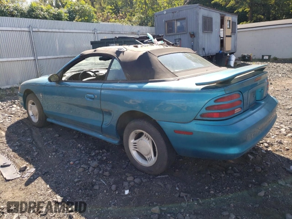 1994 Ford Mustang with VIN 1FALP4442RF186105, listed as a Copart auction lot 74677924 with 185,072 mi miles and Clean title. Bid and sale history available at DreamBid. Image 2.