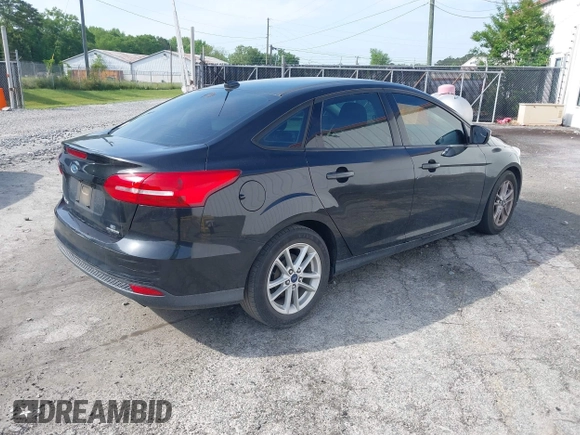 2015 Ford Focus SE with VIN 1FADP3F28FL321451, listed as a IAAI auction lot 42078087 with 181,494 mi miles and . Bid and sale history available at carsss.com. Image 4.