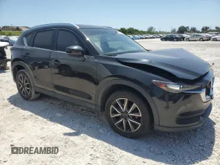 2018 Mazda CX-5 Touring with VIN JM3KFACM2J1327725, listed as a Copart auction lot 54894765 with 56,194 mi miles and Salvage Title. Bid and sale history available at carsss.com. Image 4.