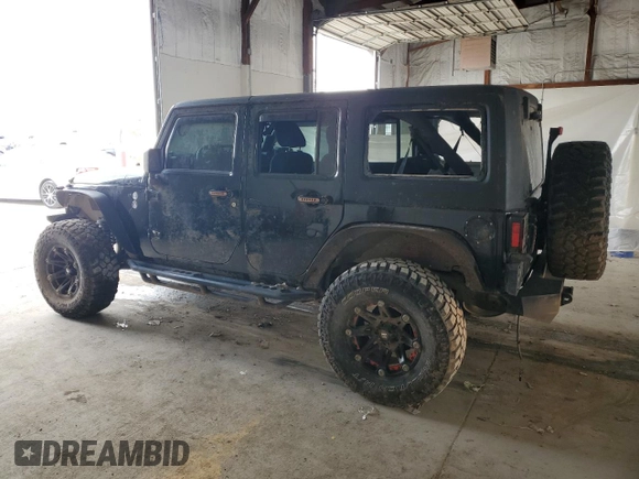 2012 Jeep Wrangler Unlimited Sahara with VIN 1C4BJWEG3CL195271, listed as a Copart auction lot 59947235 with 212,819 mi miles and Salvage title. Bid and sale history available at DreamBid. Image 2.