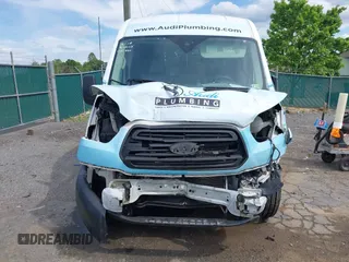 2016 Ford Transit Cargo z VIN 1FTYE1CM1GKA29370, wystawiony jako IAAI lot #42177908 z przebiegiem 155 718 mil mil oraz . Historia ofert i sprzedaży dostępna na DreamBid. Obrazek 13.